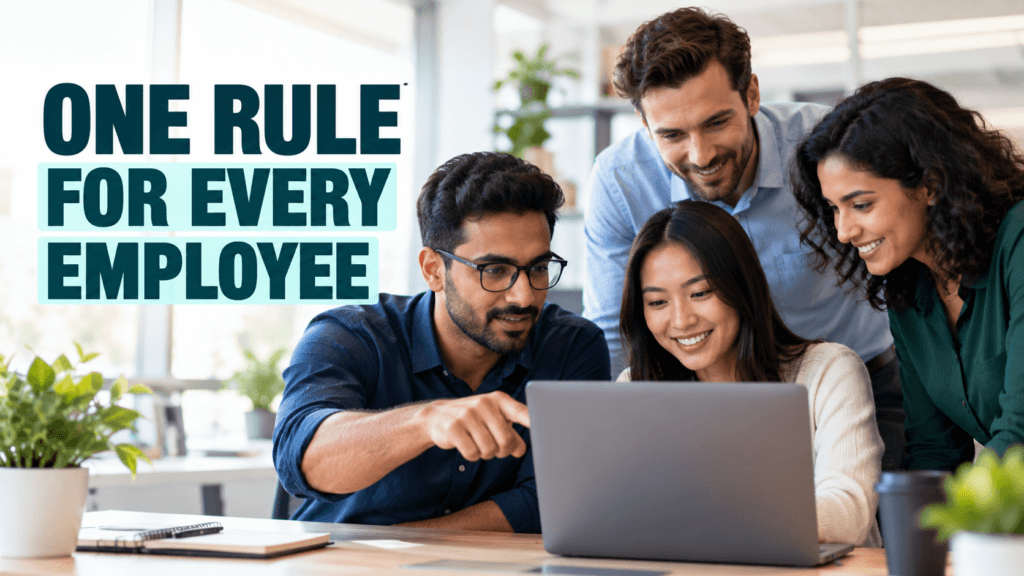 Small team gathered around a laptop agreeing on one security rule